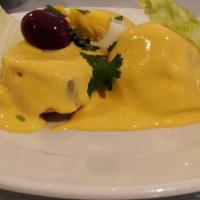 Papa a la Huancaina · Boiled potatoes topped with sauce made of fresh cheese and milk.