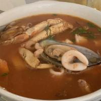 Parihuela de Mariscos · Sautéed shellfish, soup (prawns, calamari, clams, mussels, bar shrimp and fish) with a light...