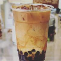Yin & Yang Milk Tea · Double shot espresso mix with black tea and milk.