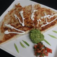 Super · Everything in the regular quesadilla plus sour cream and guacamole.