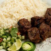 Teka Kabob (Beef) · Tender tri-tip beef infused with our homemade marinade with rice (white or Afghan brown), ah...