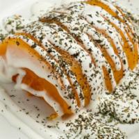 Kado Borani · Roasted squash topped with garlic sour cream and dried mint served with rice, salad and Afgh...