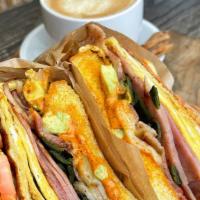 Country Bacon Sandwich · Egg, ham or turkey, Pepper Jack, fresh spinach, fresh tomatoes, red onions, chipotle mayo.