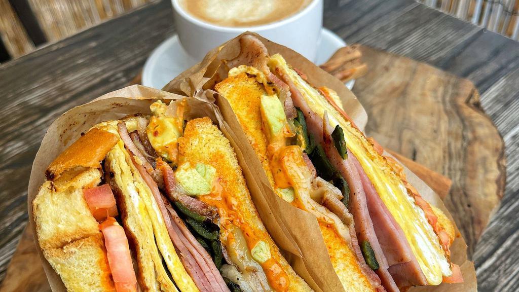 Country Bacon Sandwich · Egg, ham or turkey, Pepper Jack, fresh spinach, fresh tomatoes, red onions, chipotle mayo.
