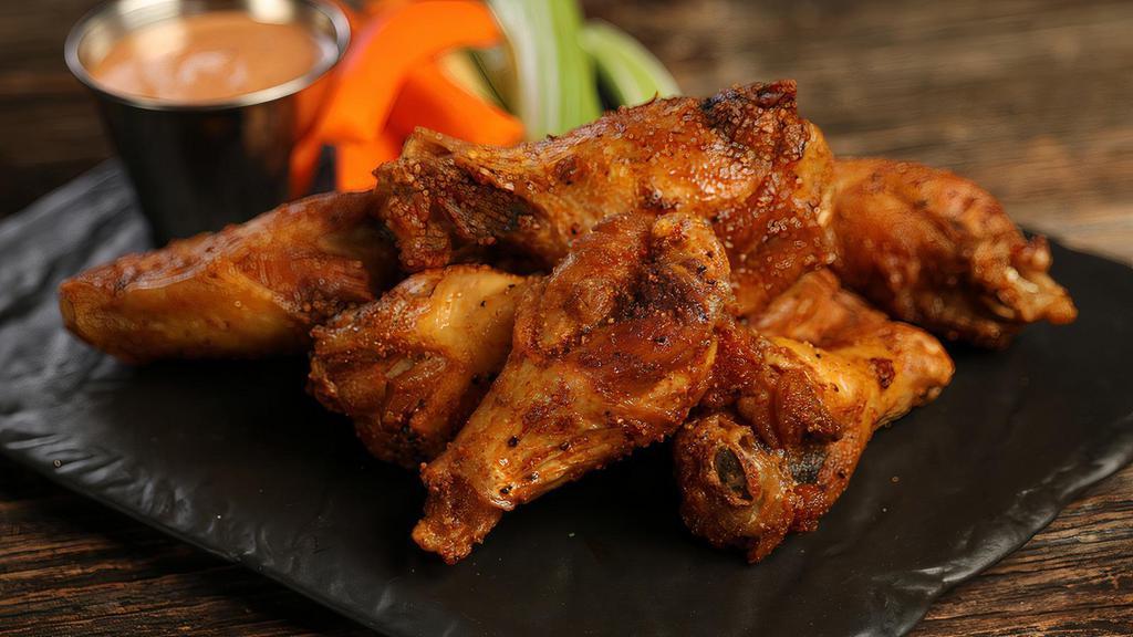 Cajun · 8 Cajun dry rub wings (mild heat), served with carrots & celery and a choice of blue cheese or ranch for dipping
