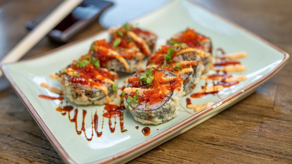 Super Dynamite Roll · Deep fried spicy tuna roll topped with tobiko, spicy unagi glaze and spicy sauce.