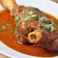 Kuna · Lamb shank cooked in special curry sauce.