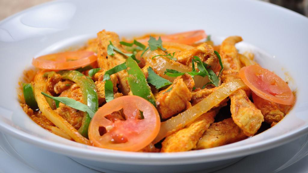 Chicken Jalfrezi · Boneless chicken cooked with ginger, garlic, onions and bell peppers.