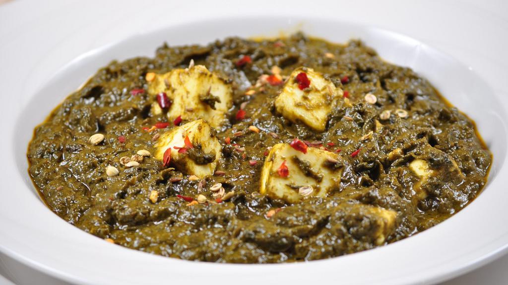 Palak Paneer · Spinach cooked with home made cheese.
