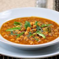Chana Masala · Vegan. Garbanzo beans cooked with ginger, garlic & spices.