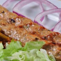 Lamb Seekh Kabaab · Ground lamb marinated with spices cooked in clay oven on skewers.