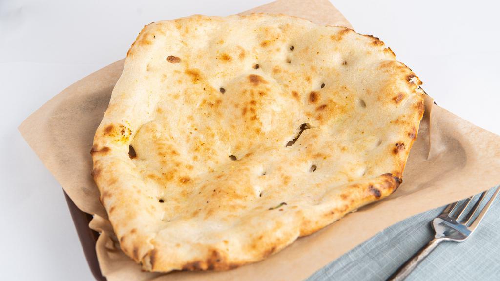 Plain Naan · Fresh oven baked bread layered with butter.