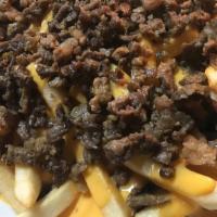 Carne Asada Cheese Fries · French fries topped with nacho cheese and grilled steak.