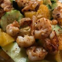 Camaron con Pepino y Naranja · Spicy shrimp served over a bed of cucumber and orange.