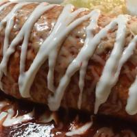 Super Burrito Enchilado (Super Wet Burrito) · Choice of meat, rice, beans, pico de gallo, sour cream, cheese and guacamole. Topped with en...