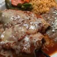 Chiles Rellenos · Vegetarian. Two toasted poblano peppers, stuffed with cheese, and topped with ranchera sauce...