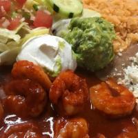 Camarones a la Diabla · Spicy. Shrimp in home-made spicy sauce served with rice, beans, salad, and tortillas.