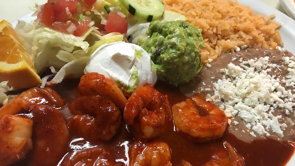 Camarones a la Diabla · Spicy. Shrimp in home-made spicy sauce served with rice, beans, salad, and tortillas.