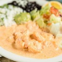 Camarones en Crema de Tequila · Shrimp sauteed in a creamy chipotle tequila sauce. Served with rice, beans, salad, and torti...