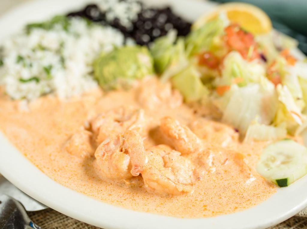 Camarones en Crema de Tequila · Shrimp sauteed in a creamy chipotle tequila sauce. Served with rice, beans, salad, and tortillas.