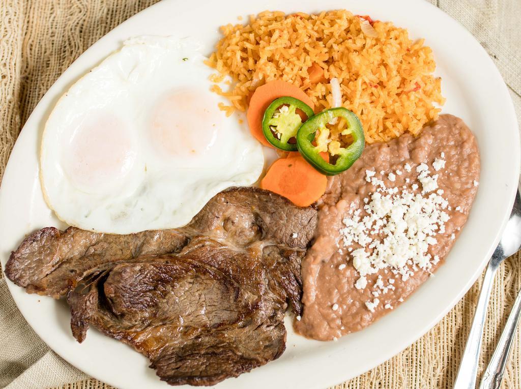 Huevos con Carne Asada al Lado · Eggs with a side of steak. Served with rice, beans, and tortillas.