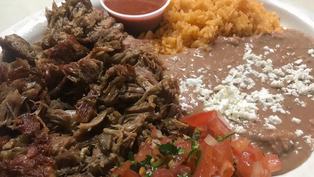 Carnitas Dinner · Fried shredded pork served with pico de gallo, rice, choice of beans, and tortillas.
