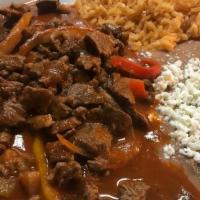 Steak Ranchero Dinner · Steak strips in ranchera sauce. Served with choice of beans, rice, and tortillas.