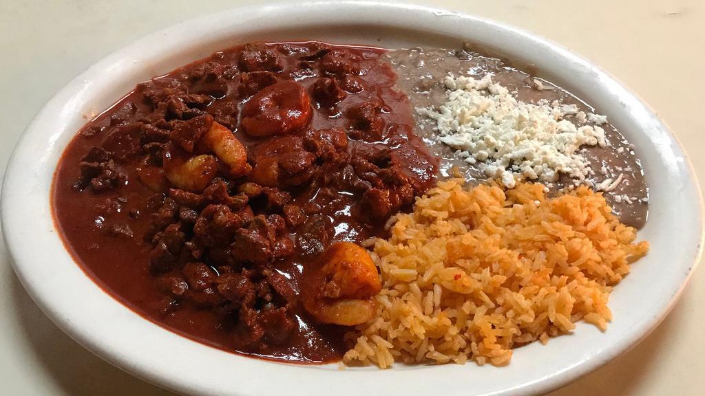 Mar y Tierra Dinner · Shrimp and steak sauteed in hot sauce. Served with rice, choice of beans, and tortillas.