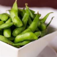 Edamame · Gluten free. Steamed young green soybeans, lightly salted with Kosher salt.