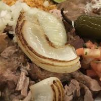 Carnitas Family Pack Feeds 3-4 People · Feeds 3-4 People 
2lbs of Carnitas (Shredded Pork) 
2lbs of Rice 
1lbs of Beans 
20 Corn Tor...