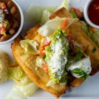 Flautas Plate · Deep-fried tacos with lettuce, cotija cheese, sour cream and your choice of carnitas or chic...