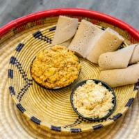 Yedoro Kitfo · Boneless, skinless, ground chicken soaked in a herbed butter sauce and Mitmita (Ethiopian Ch...