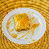 Baklava · A traditional Greek pastry made with layers of bleached wheat flour fillo dough, filled with...