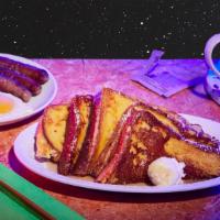 French Toast Combo · Two eggs, four slices of French toast, maple syrup, butter.