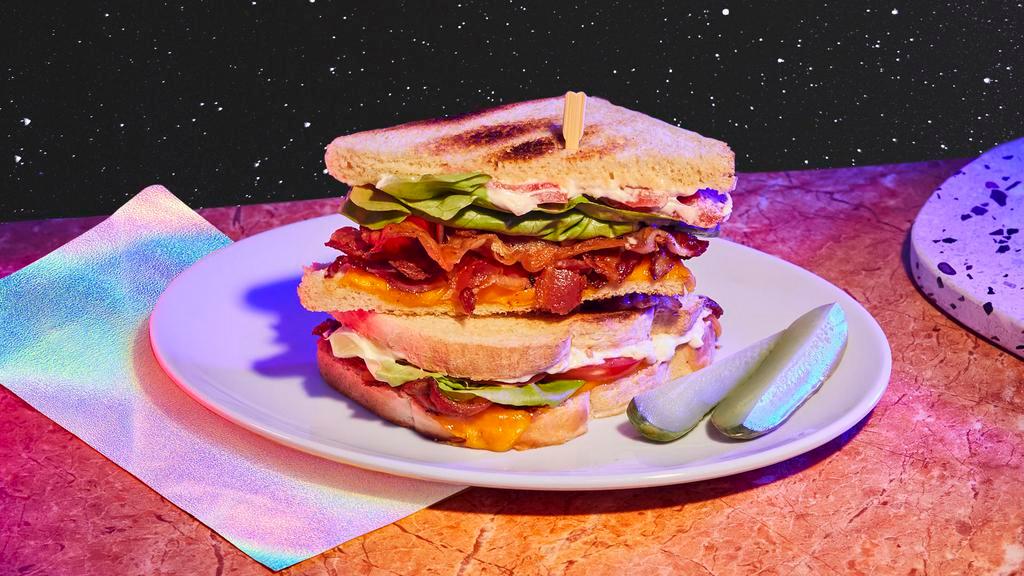 Blt · Crisp bacon, lettuce, sliced tomato, mayo, your choice of bread.