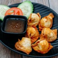 Crab Rangoon · Crabmeat and cream cheese wrapped with wonton wrapper then deep-fried and served with our ho...