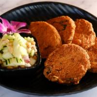 Thai Fish Cakes  · Fried  Fish Cakes: mixed with Curry Paste, Kaffir Lime Leaves, and String Bean served with C...