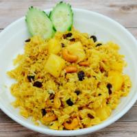 94B. Pineapple Fried Rice · Pan fried rice with curry powder,  pineapple, cashew nuts, raisins.