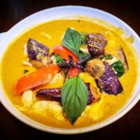 28. Red Curry · Spicy red curry with coconut milk, eggplants, bell pepper, jalapeño  and basil,