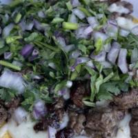 Super Taco · Meat, onion, cilantro y salsa, sour cream & guacamole.