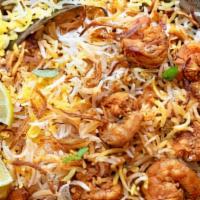 Jumbo Shrimp Biryani · Shrimp with traditional Hyderabadi herbs, spices and cooked with aromatic basmati rice.
