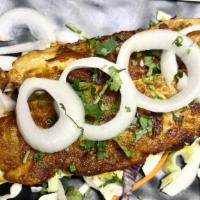 Tawa Fish Fry · White fish marinated with ginger, garlic and traditional spices