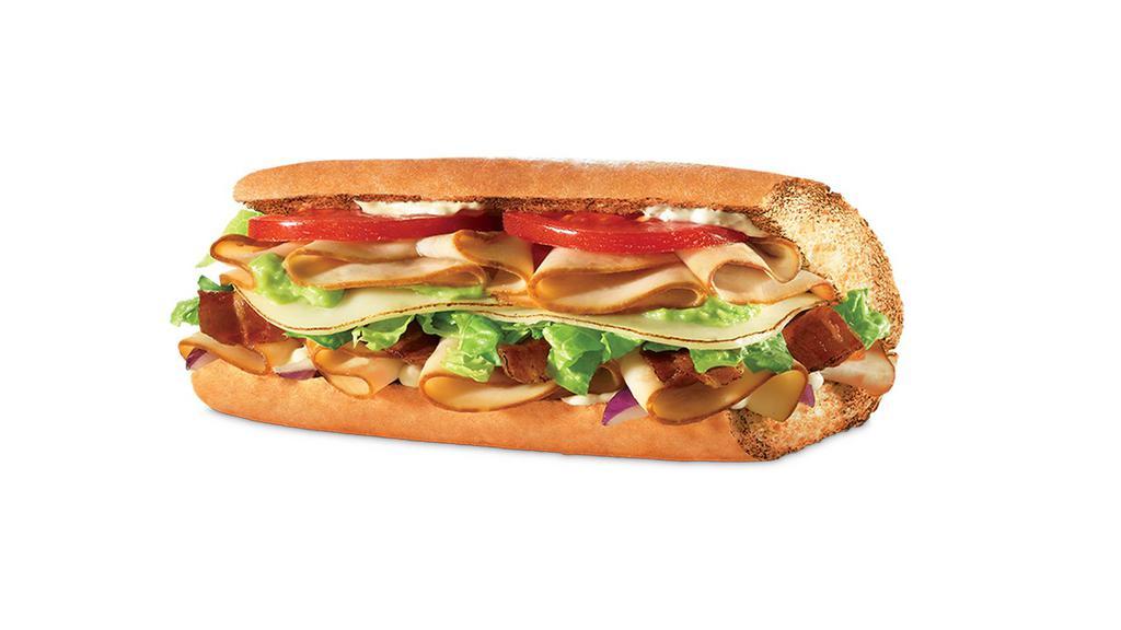 Turkey Bacon Guacamole · Turkey, bacon, guacamole, provolone, lettuce, tomatoes, onions, ranch.