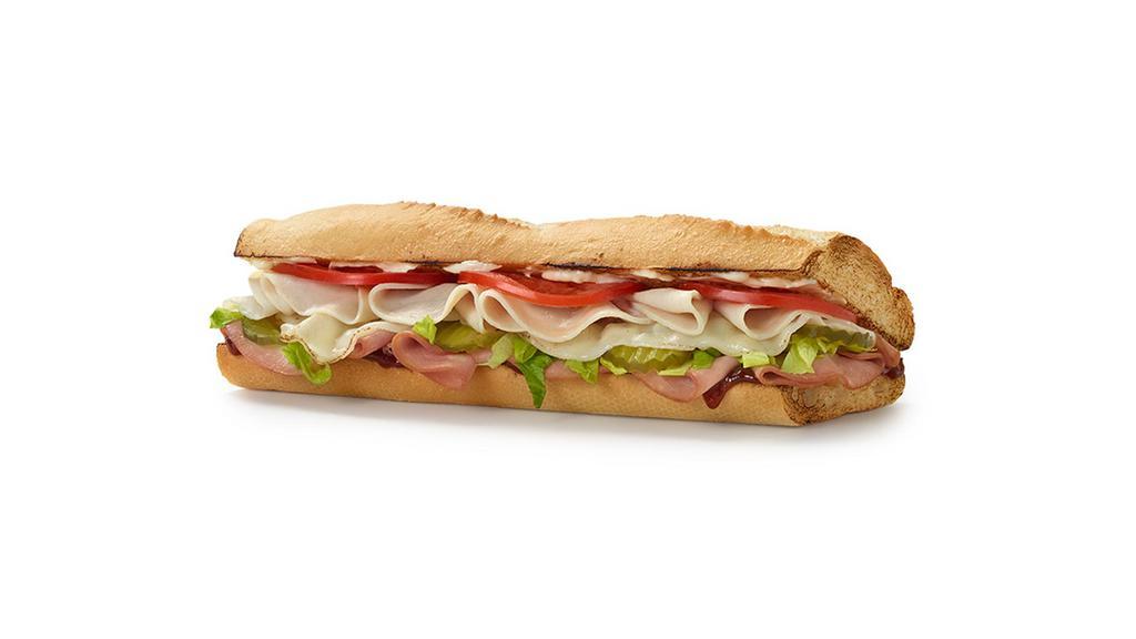Spicy Monterey Sandwich · Spicy. Turkey, ham, mozzarella cheese, pickles, lettuce, tomatoes, mayonnaise, and a four-pepper chili sauce with italian white bread.