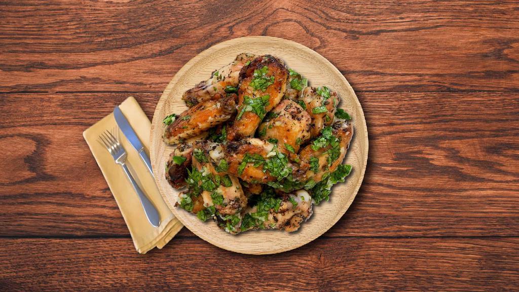 Garlic Glutton Wings · Classic, succulent, golden fried chicken wings, tossed in a creamy garlic & parmesan sauce.