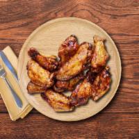 S'more BBQ Wings · Classic, succulent, golden fried chicken wings, tossed in our smoky backyard BBQ sauce.
