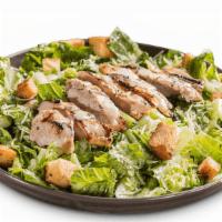 Chicken Caesar Salad · Crisp romaine lettuce tossed in Caesar dressing, topped with sliced, grilled chicken breast....