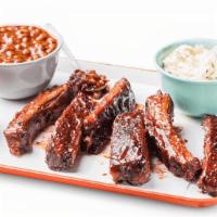 Louis-Style Spareribs - Half Slab (6 Bones) · Hand-rubbed with Dave's secret blend of spices and pit-smoked for 3 - 4 hours over a smolder...