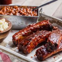 Louis-Style Spareribs - 1/3 Slab (4 Bones) · Hand-rubbed with Dave's secret blend of spices and pit-smoked for 3 - 4 hours over a smolder...