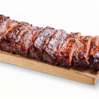Louis-Style Spareribs (Big Slab) · Hand-rubbed with Dave's secret blend of special spices and pit-smoked for 3-4 hours over smo...